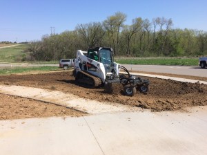 Harley Rake Skid Loader attachment grading a yard